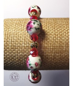 Pulsera dorada de cerámica y cristal rojo