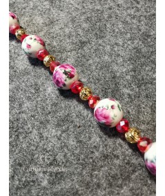 Pulsera dorada de cerámica y cristal rojo