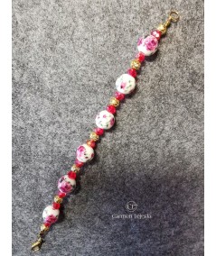 Pulsera dorada de cerámica y cristal rojo